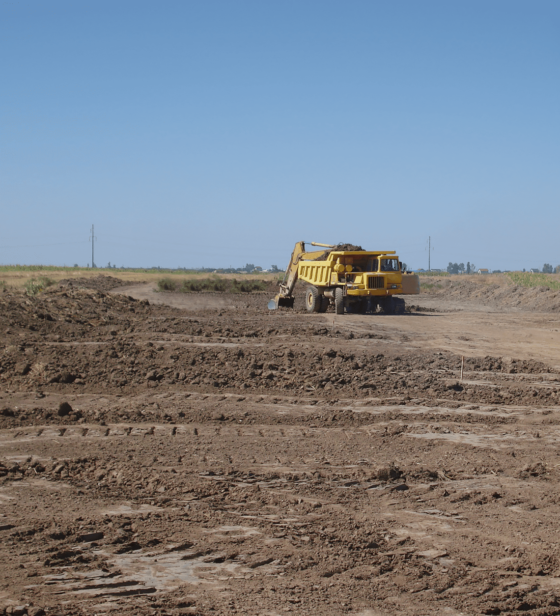 Heavy machinery on dirt field