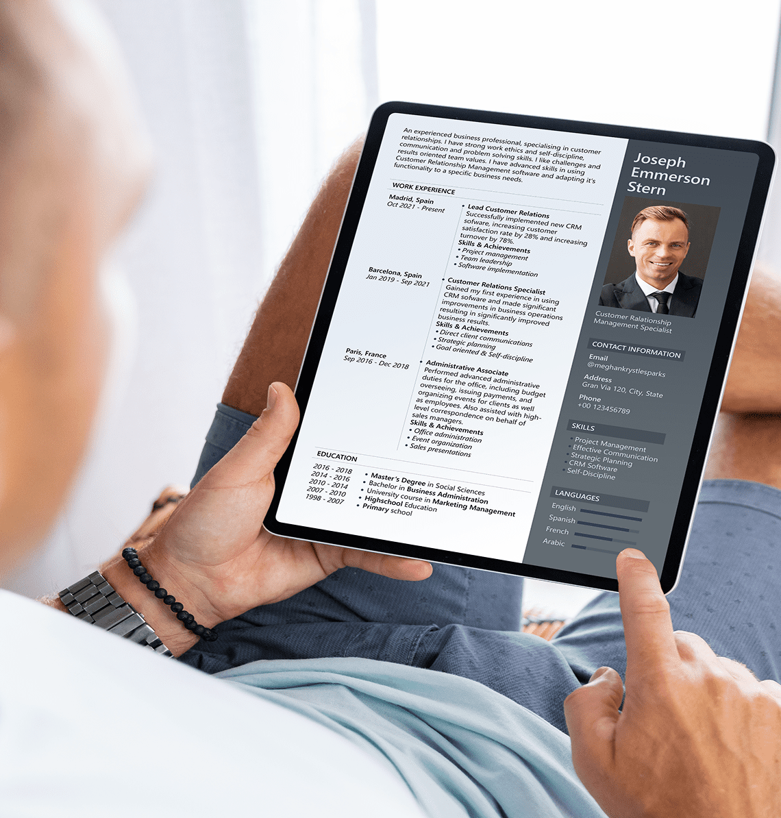 Person reviewing a digital resume on a tablet.