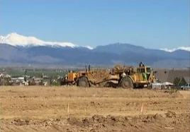 Construction vehicle on dirt field