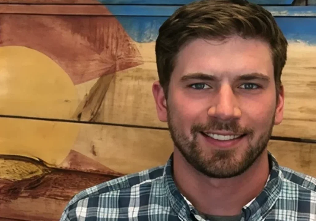 Smiling man with beard and short hair